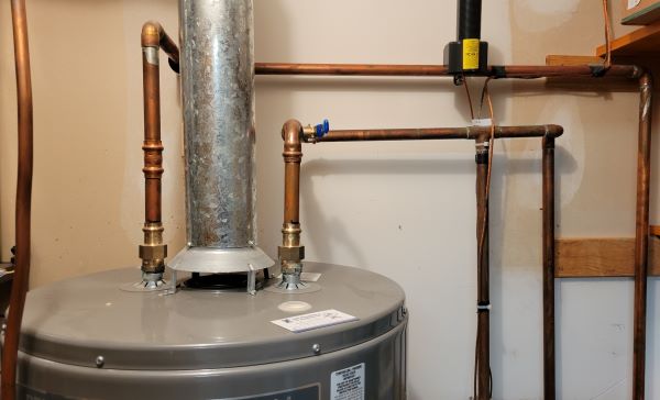 Pipes above hot water heater