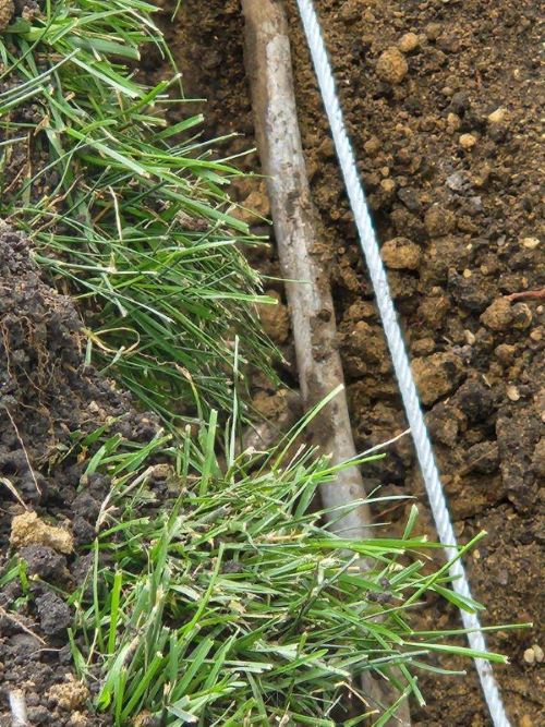 pipe and cable in dirt